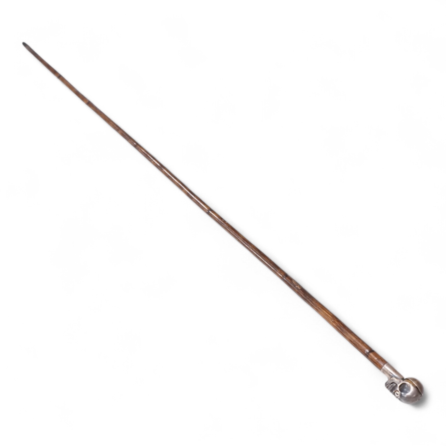 A 19th century bamboo walking stick with memento mori skull finial, the skull with articulated jaw, 84cm in length